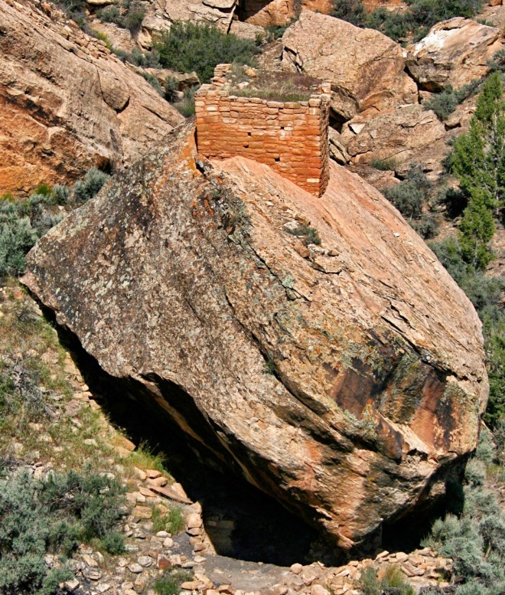 Structure built on top of fallen boulder