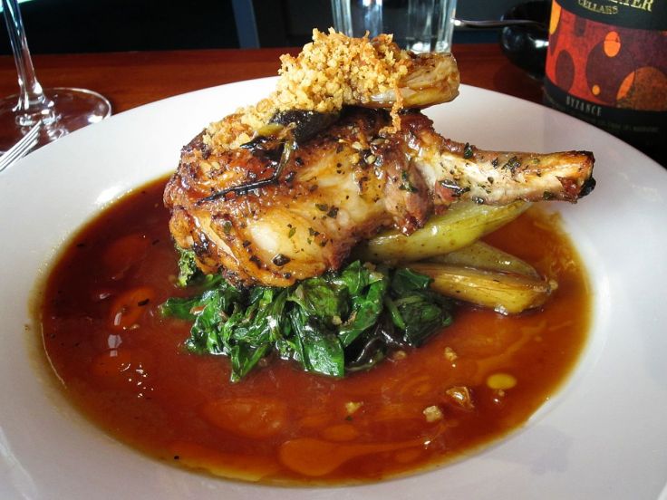 Tails & Trotters Pork Chop with Braised Kale and Fingerling Potatoes