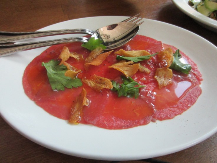 Grass-fed beef crudo with salt & pepper garlic chips