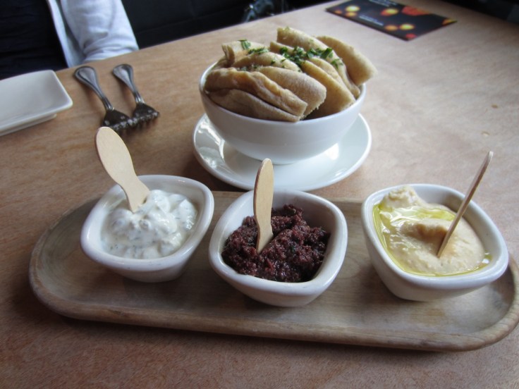 Tzatziki, olive-fig and fava spreads with pita