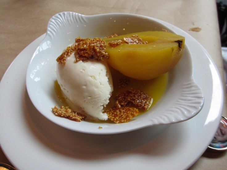Saffron citrus poached pear with honey ice cream & sesame seeds