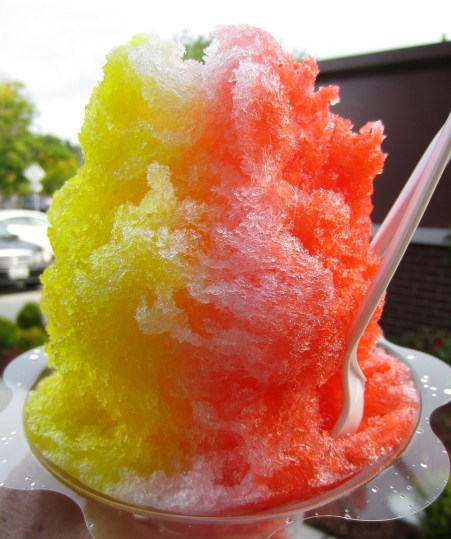 Shave ice with passionfruit, mango and coconut syrups
