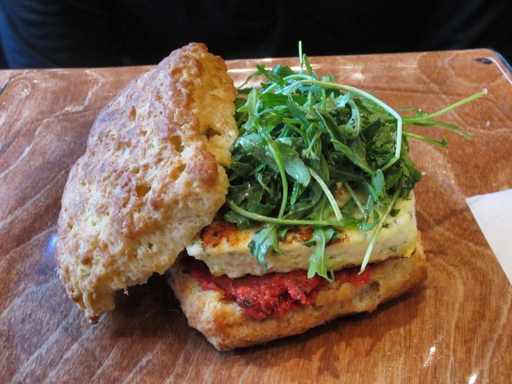 Biscuit with truffled frittata, tomato caper relish and arugula