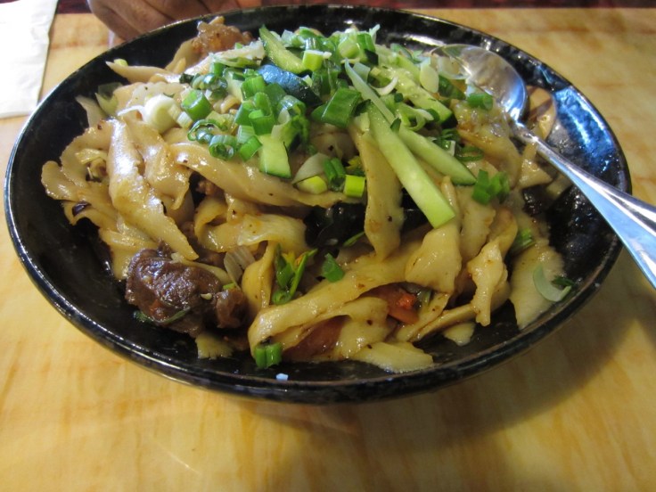 Hot & spicy sauce over hand-shaven noodles with beef