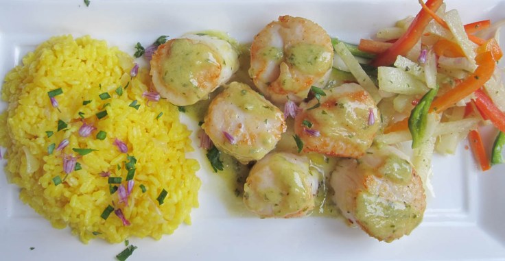 Colossal scallops, lemon-garlic vinaigrette, saffron rice, vegetable and jicama slaw