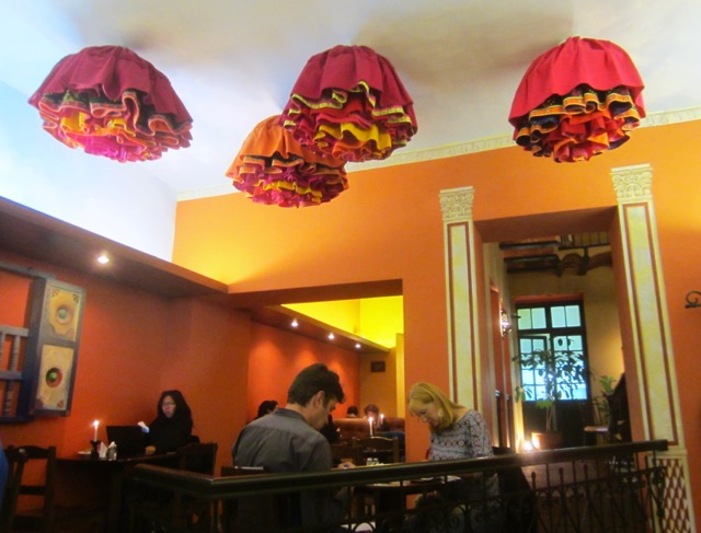 Light shades on the ceiling of Café Banais were made to look like cholita skirts